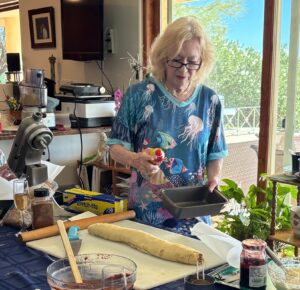 Home baker brushing egg wash on dough