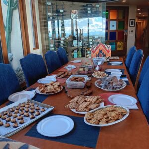 Table laden with assorted cookies and pastries