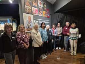 Visitors posing in Ray Harryhausen film exhibit