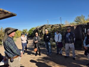 Small outdoor tour group listening to guide