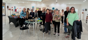 People posing in bright contemporary art gallery