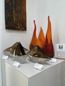Tall orange glass flames with amber bowls
