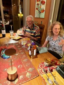 Two people dining at cozy, decorated table