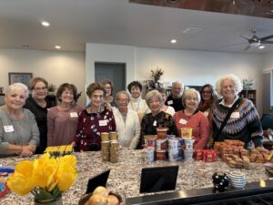Smiling volunteers packing food donations