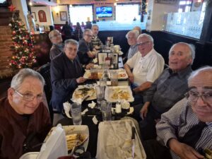 Men gathered for meal at festive restaurant
