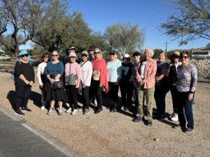 Outdoor walking group posing on sunny trail
