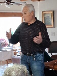 Man gesturing while speaking in living room
