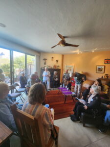 Seniors gathered in sunlit cozy living room