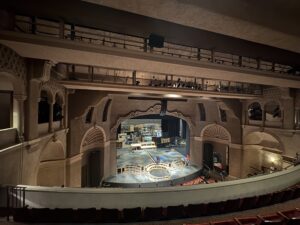 Empty ornate theater interior with stage set