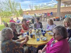 Group of women dining outdoors on patio