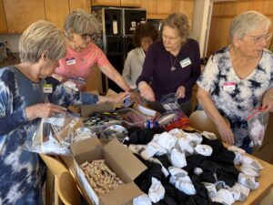 Group packing socks and hygiene care kits