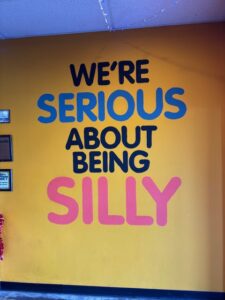 Mural reading "We're serious about being silly