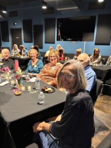 Older adults enjoying community dinner event